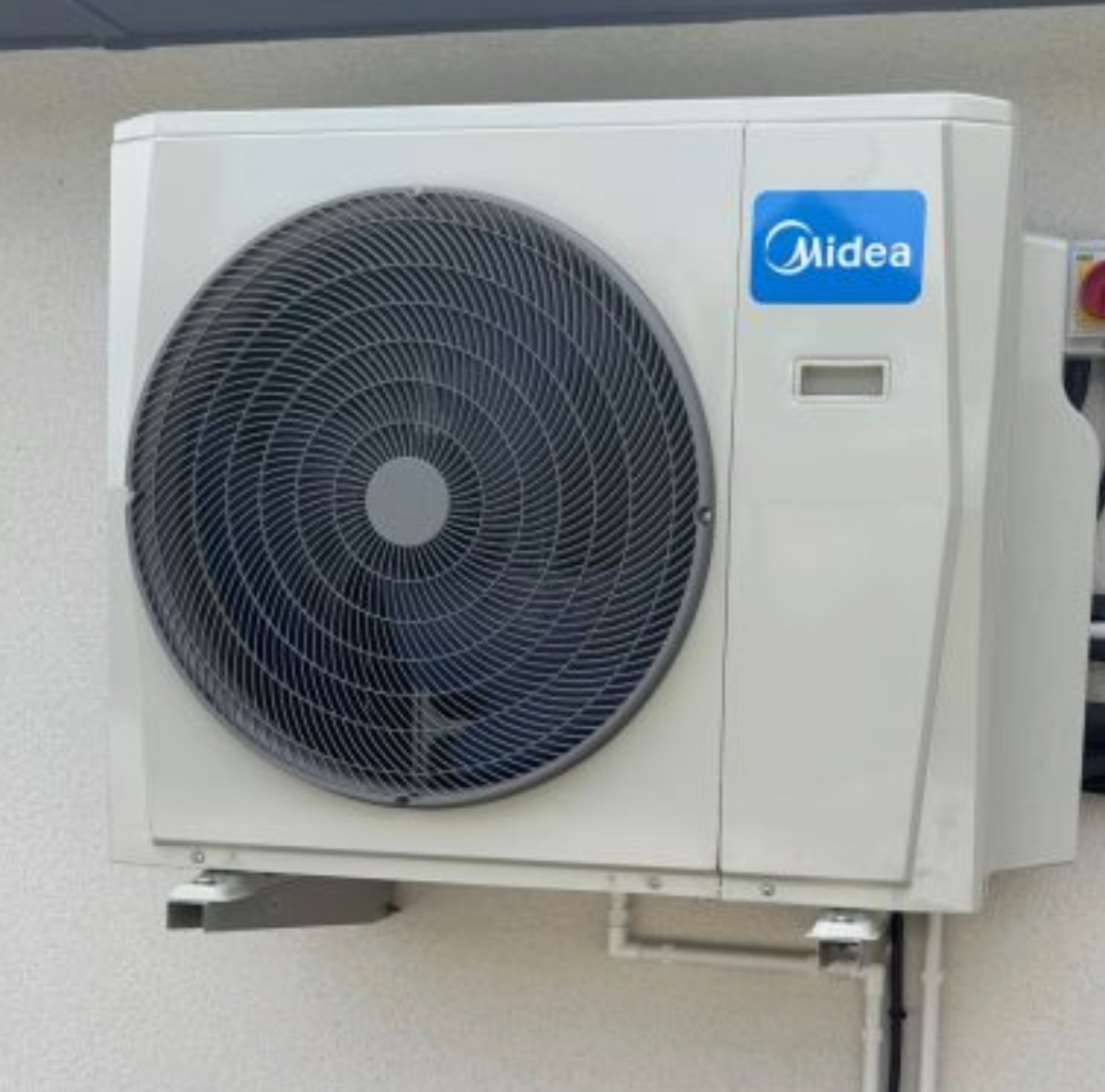 air source heat pump on outside wall